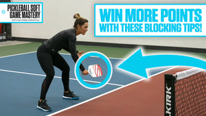 Player demonstrating a pickleball block volley technique with paddle positioned to absorb the ball.
