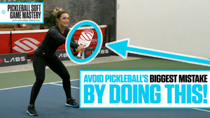 Catherine Parenteau demonstrates a low, squatted position in the transition zone, with text: 'Avoid Pickleball's Biggest Mistake By Doing This!'