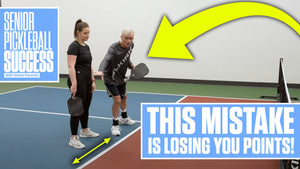 A senior man demonstrating a pickleball mistake with a woman, text reads 'THIS MISTAKE IS LOSING YOU POINTS!'