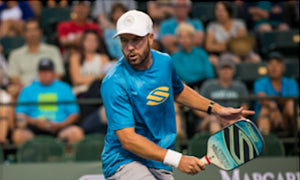 Morgan Evans playing pickleball during a tournament.