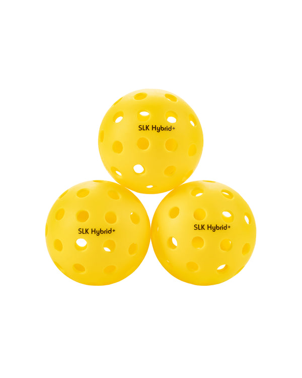 Three yellow SLK Hybrid+ pickleballs stacked together.