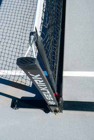 Close-up of Selkirk Semi-Permanent Pro Pickleball Net showing the frame and net attachment.