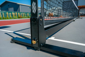 Close-up view of the Selkirk Semi-Permanent Pro Pickleball Net's frame and support structure.