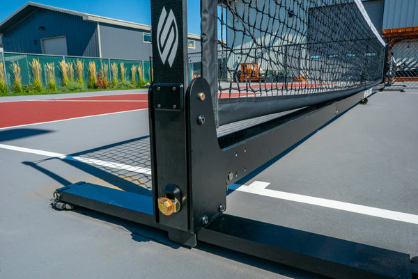 Close-up view of the Selkirk Semi-Permanent Pro Pickleball Net's frame and support structure.