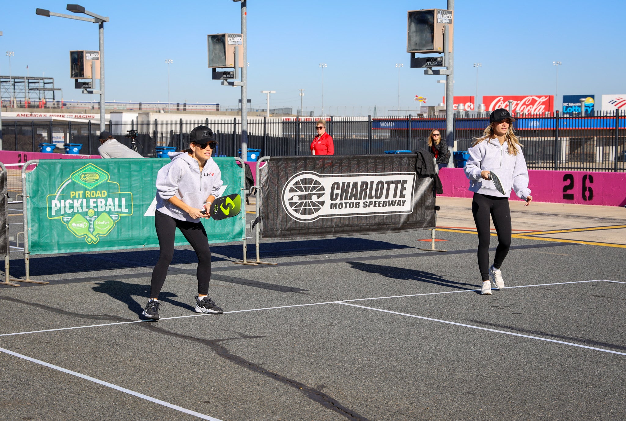 Two women playing pickleball at Charlotte Motor Speedway