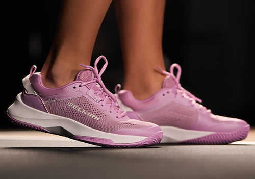 Women's CourtStrike Pickleball Shoes in pink, showing side view on a foot.