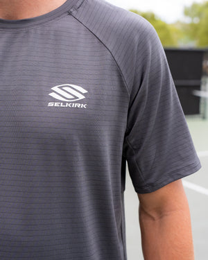 Short-sleeved Selkirk TruWear Men's Cardinal Workout Shirt in black with logo on chest.