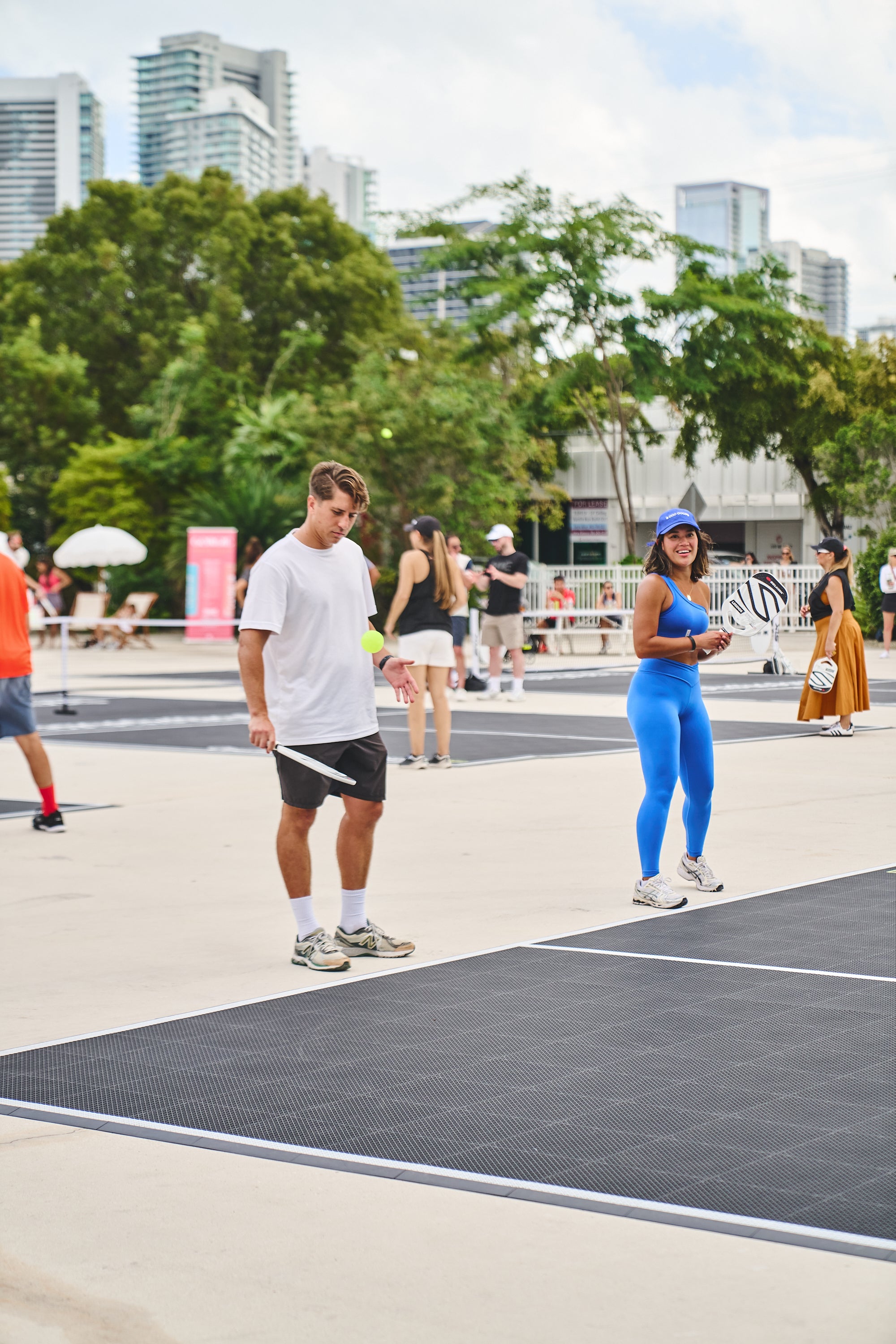 Participants playing pickleball at the PICKLEBASEL event in Miami.