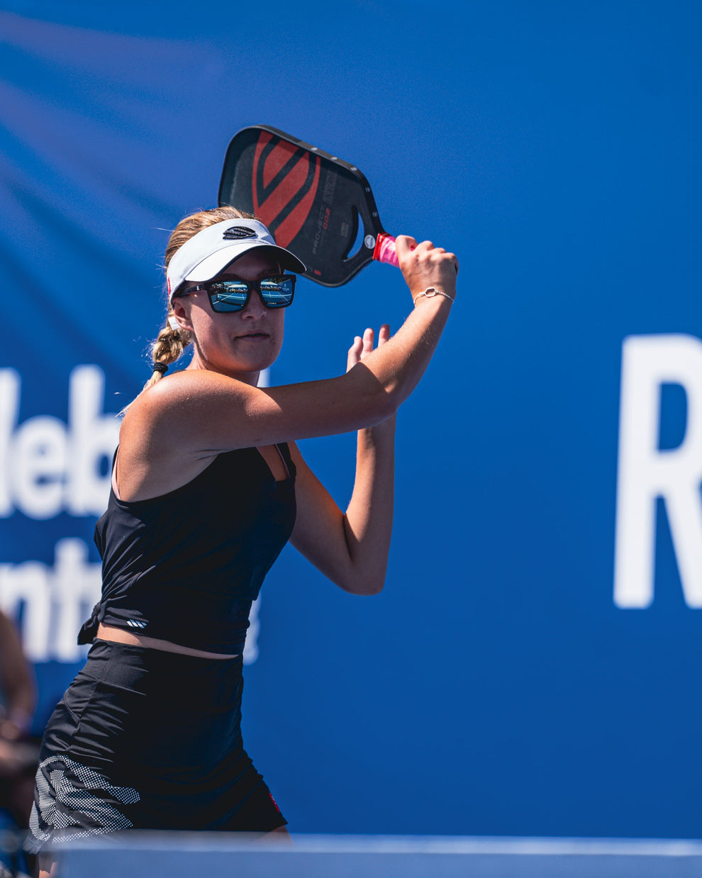 Maggie Brascia preparing to hit a pickleball shot during a match