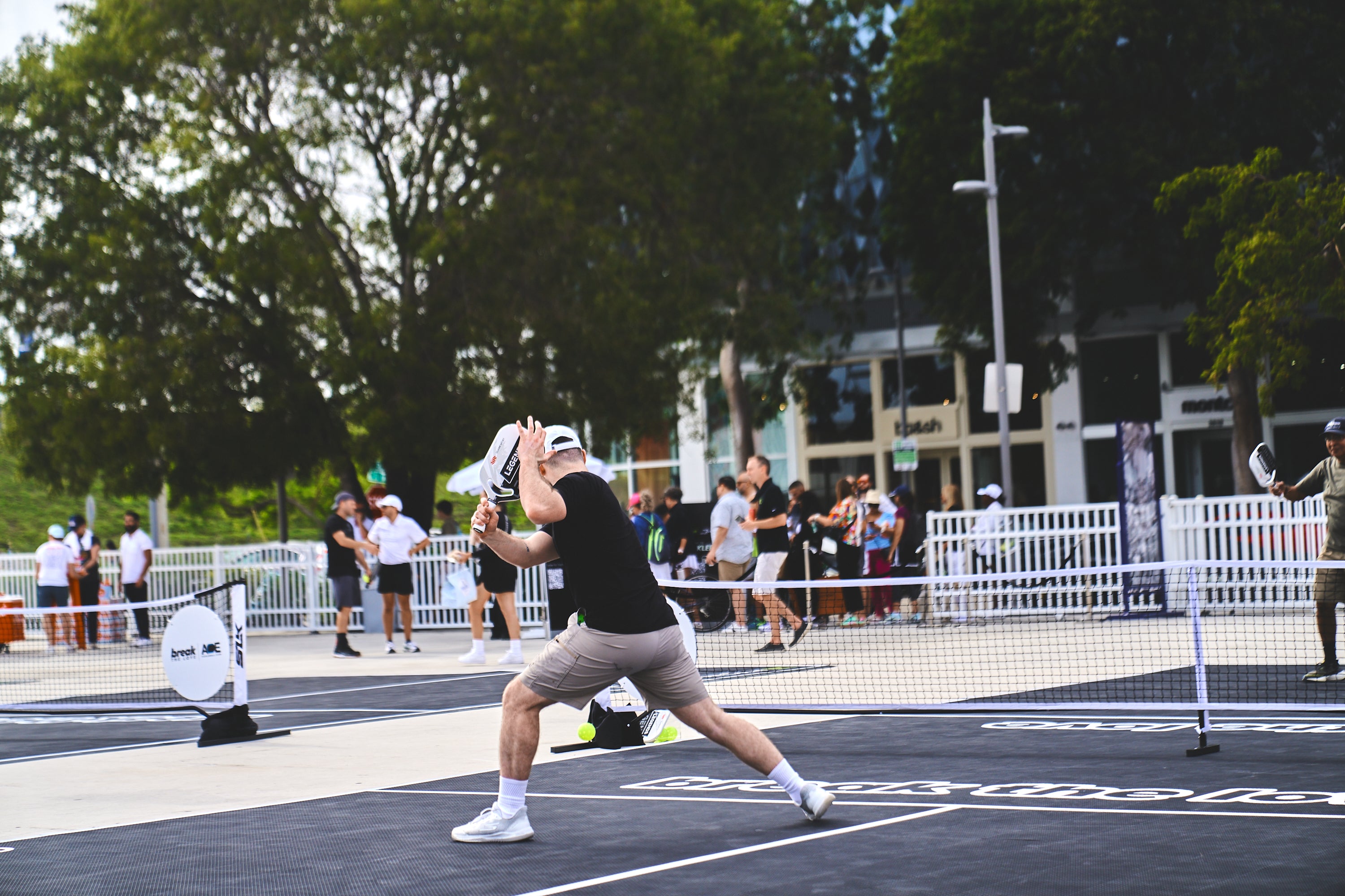 A player hitting a pickleball during the PICKLEBASEL event in Miami.