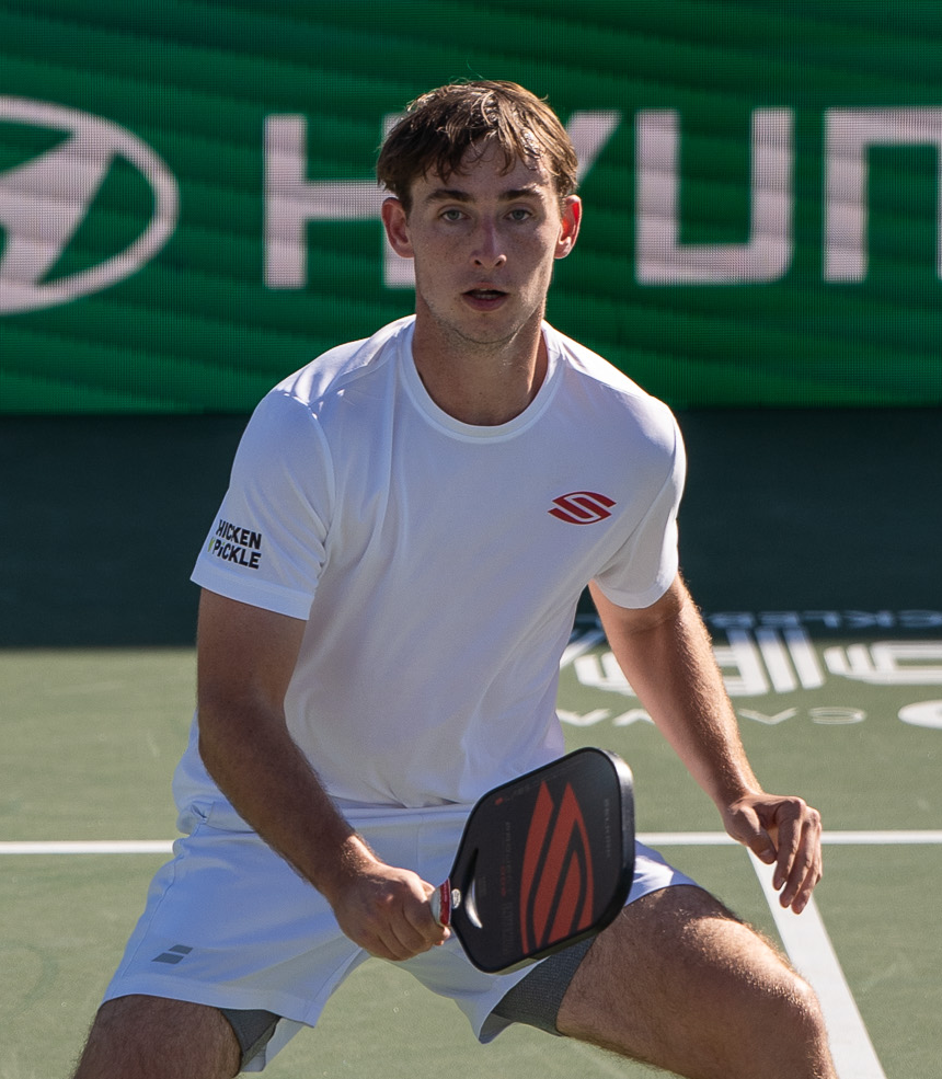 Dylan Frazier preparing to play pickleball on a court