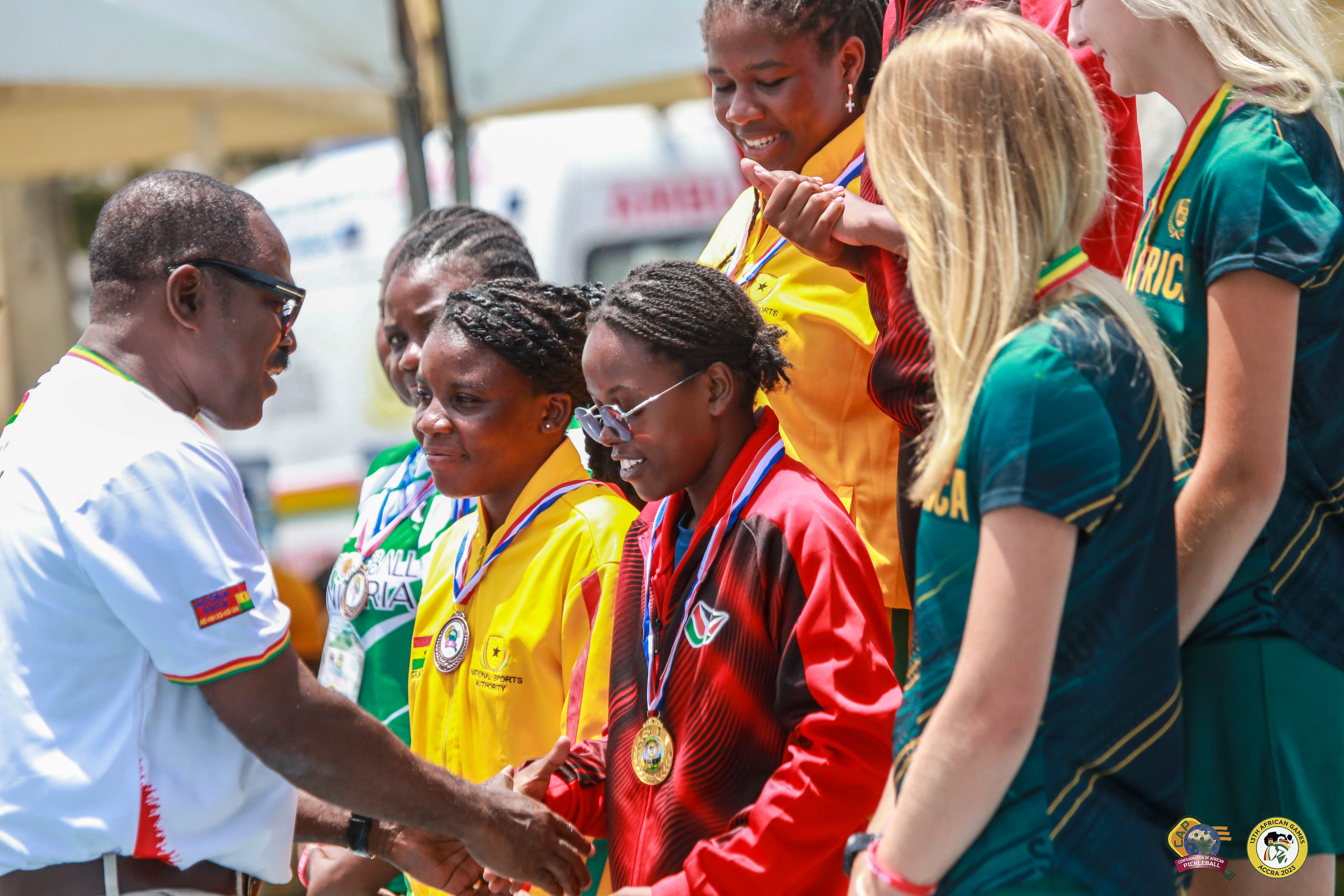 A group of female pickleball players receiving medals at the 13th African Games.