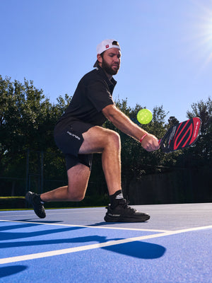 A player in action wearing Men's CourtStrike Pro Pickleball Shoes on a court.