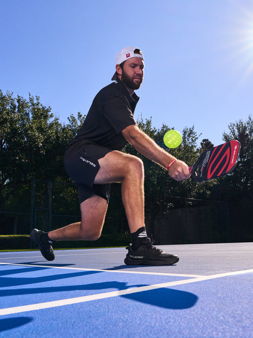 A player in action wearing Men's CourtStrike Pro Pickleball Shoes on a court.