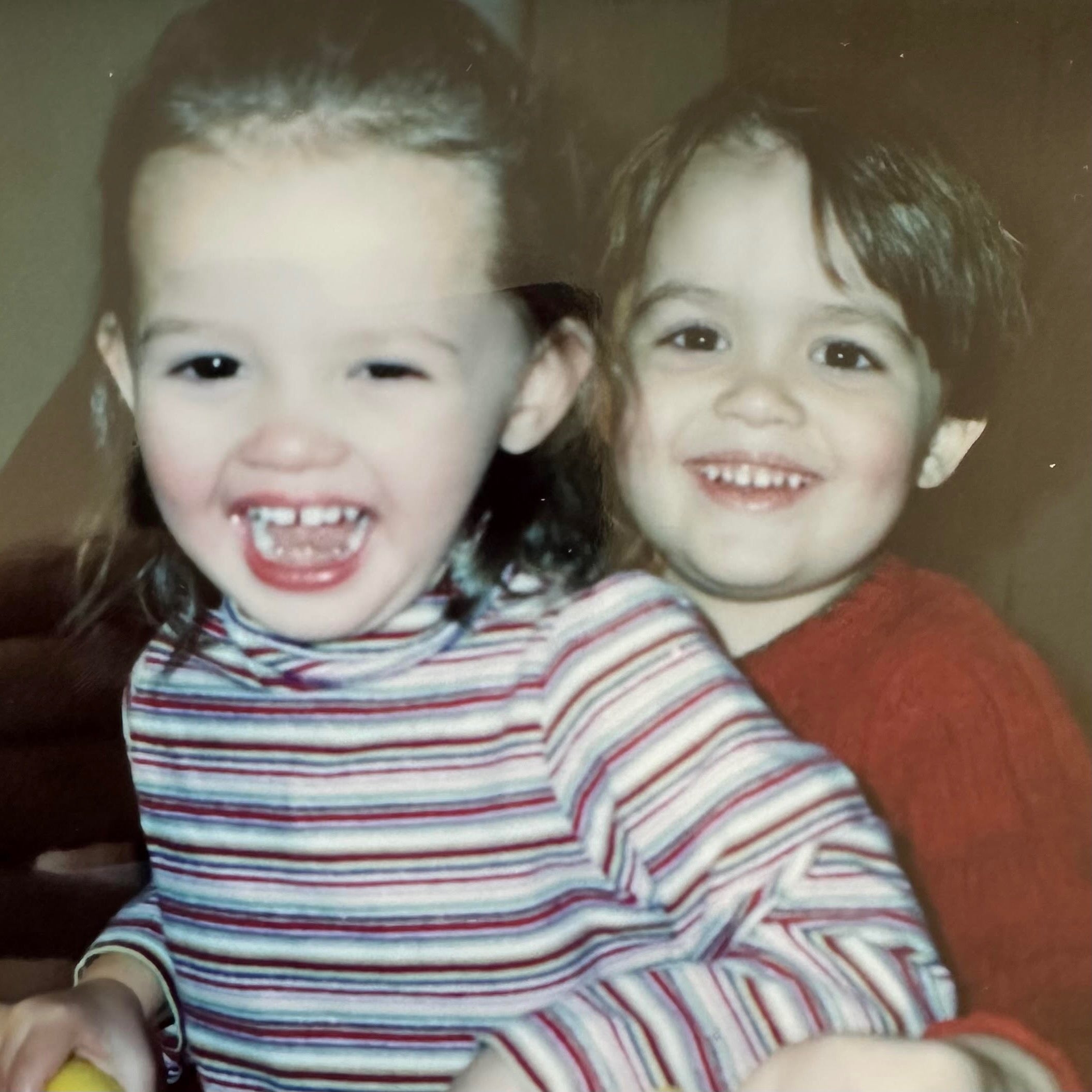 Pickleball pros Ava and James Ignatowich smiling together, showing joy and connection.