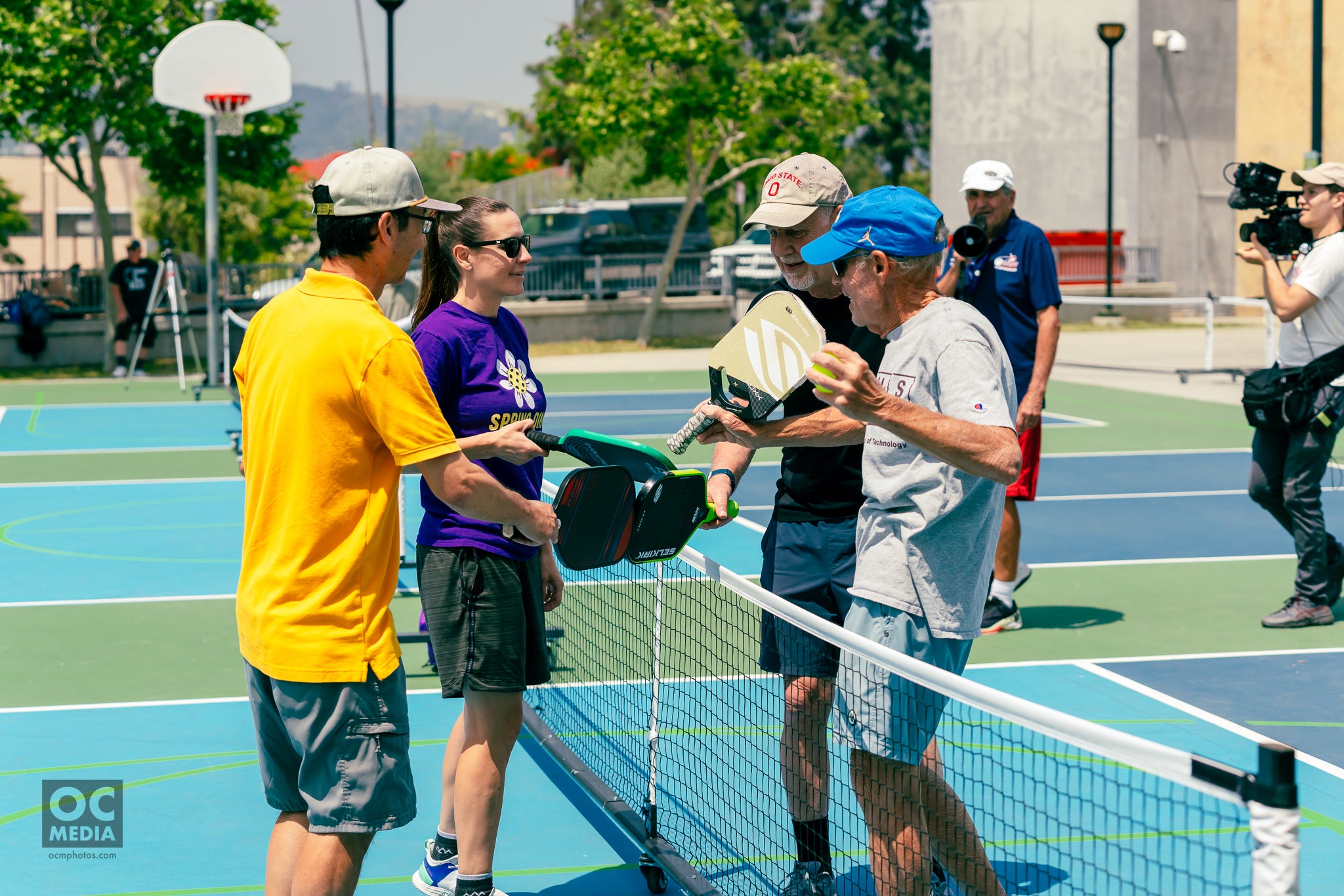 Participants engaging in a pickleball match, promoting exercise for individuals with Parkinson's disease.