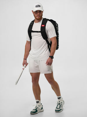 Model wearing Men's Pro Line Athletic Short Sleeve shirt in Chalk color, holding a pickleball paddle.