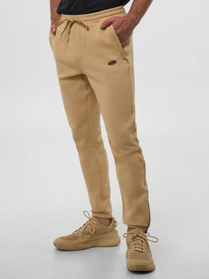 Men’s Pro Line Knit Jogger in sand color, featuring side pockets and a drawstring waist.