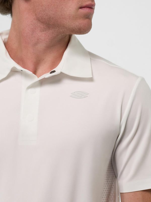 Model wearing Men's Pro Line Performance Polo in Chalk color, showing collar and logo.