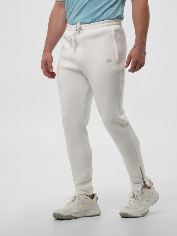 Model wearing Men’s Pro Line Knit Jogger in Chalk color, showcasing zippered ankles.