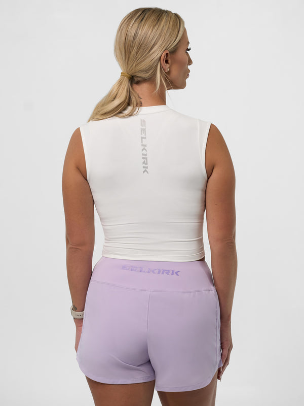 Model wearing Women's Pro Line Cap Sleeve Fitted Tee in Chalk, showing back view.
