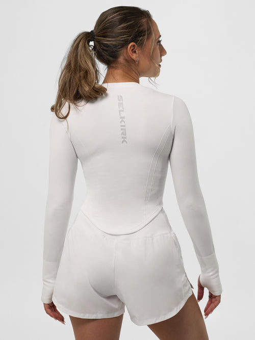 Model wearing Women's Pro Line Seamless Long Sleeve in Chalk, showing back view.
