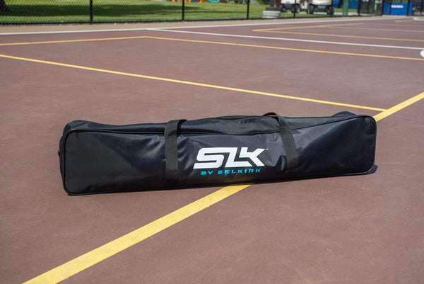 Carrying bag for SLK Pro Portable Pickleball Net on a court