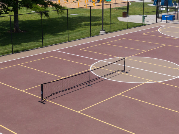 Aerial view of the SLK Pro Portable Pickleball Net set up on a court.