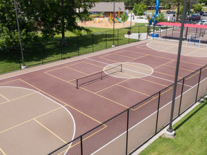 Aerial view of a pickleball court with a net in the center.