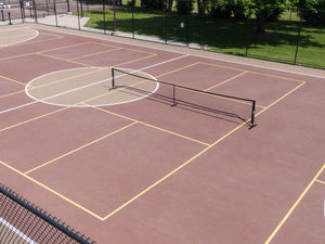 Aerial view of the SLK Pro Portable Pickleball Net set up on a court.
