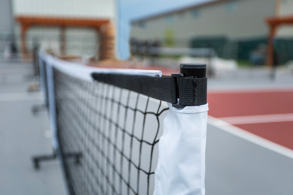 Close-up of the SLK Prime Portable Pickleball Net showing the net attachment and frame.