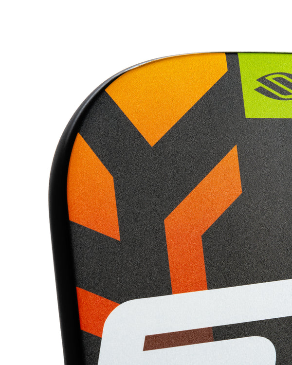 Close-up of SLK OMEGA Hybrid Air paddle design featuring orange and black colors with logo.
