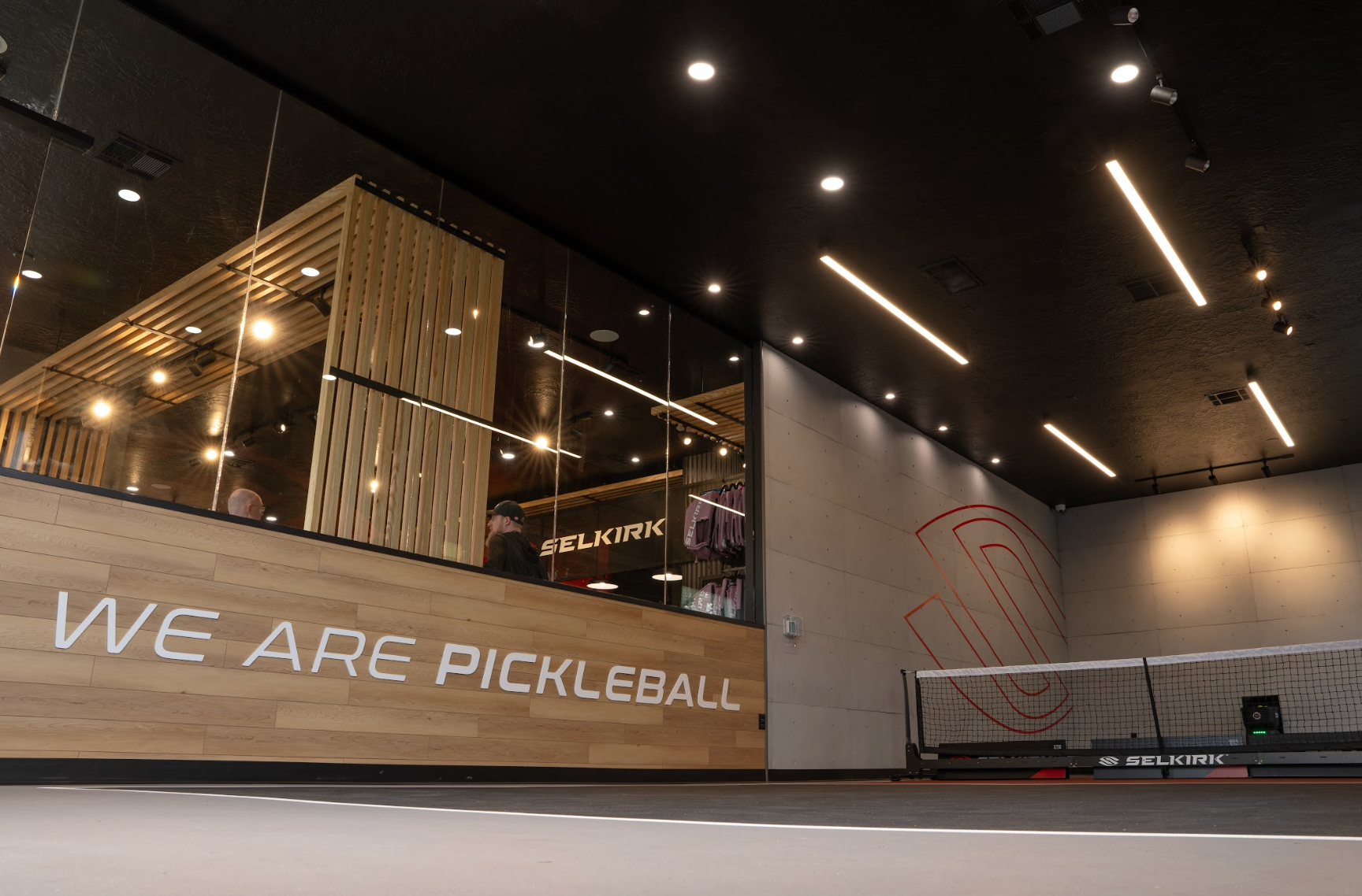 An indoor skinny pickleball court is attached to the side of the Selkirk Pro shop. 