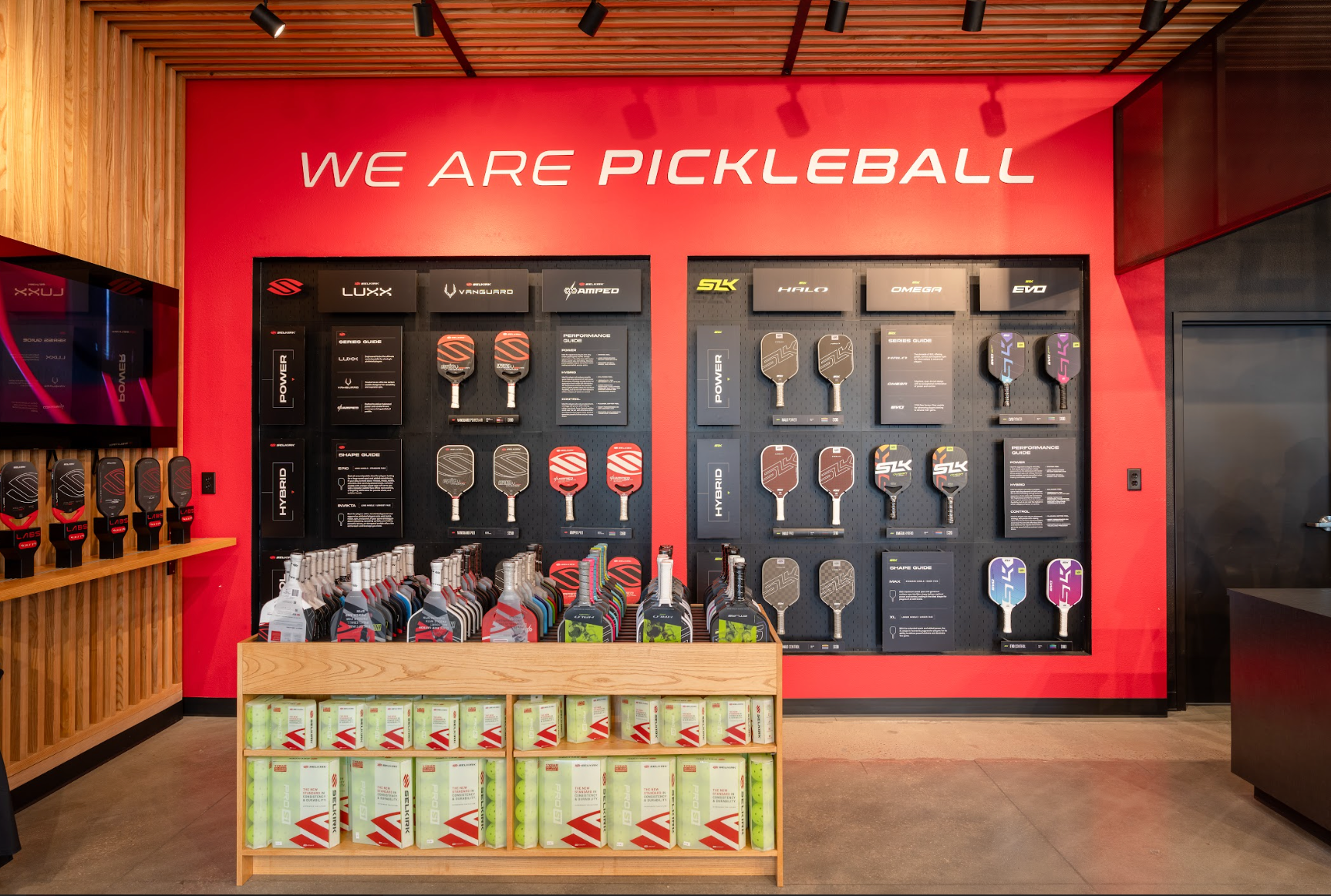 A paddle wall in the Selkirk Pro Shop shows the difference between paddle shapes. 