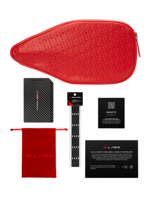 Red paddle case with accessories including a carbon fiber item and security card.