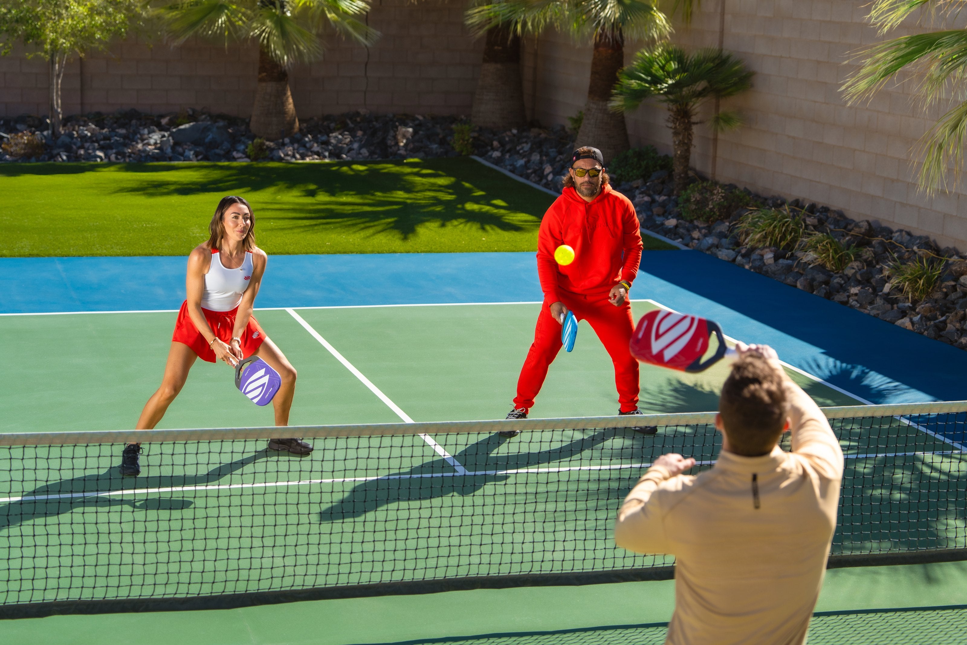 Players on court with the Selkirk LUXX Control Air with InfiniGrit pickleball paddle