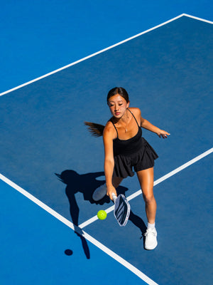 Player hitting a backhand with the OMNI Chalk paddle