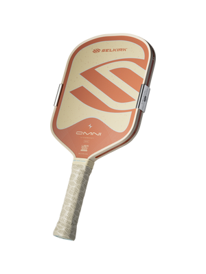 Front angled view of Selkirk OMNI Pickleball Paddle showcasing its beige and orange face on an isolated background