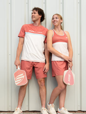 Two players holding Boomstik Canyon Clay paddles in Canyon Court apparel