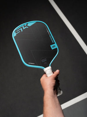 SLK ERA Power pickleball paddle, Cyan, on court 2