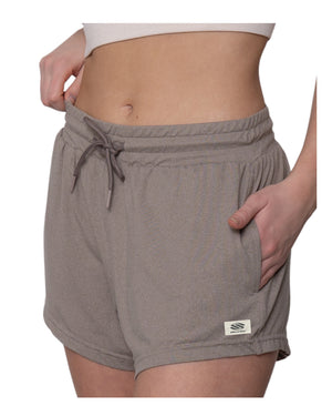 Taupe drawstring lounge shorts with side pockets, worn by model cropped at the midriff