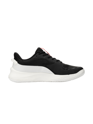 Black low-top athletic sneaker, side view; textured upper, white chunky sole, red tongue pull tab.