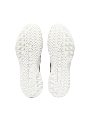 White sneaker outsoles with zigzag tread and embossed text 'SETRKS' running down each sole