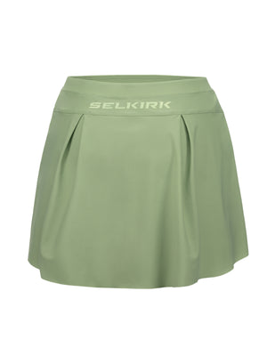 Sage-green athletic skort with pleated front and SELKIRK logo on the wide waistband