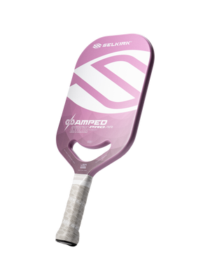 Pink Selkirk paddle with white 'SELKIRK' logo, 'AMPED PRO AIR', 'INVICTA' and small 'USA' text