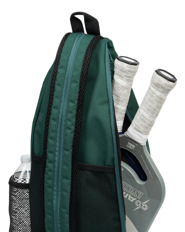 Core Line Pickleball Sling Bag in Forest Green with paddle and water bottle
