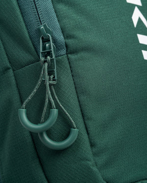 Close-up of zipper pullers on Core Line Pickleball Sling Bag in Forest Green