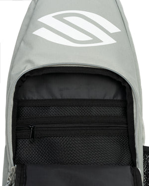 Close-up of Selkirk Pickleball Sling Bag open compartment with zippered mesh pocket and gray fabric with white logo
