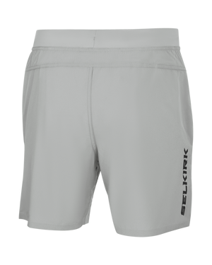 Rear view light gray athletic shorts with elastic waistband and vertical 'SELKIRK' logo on right leg.