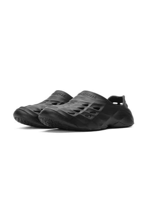 Selkirk Sport Renew Pickleball Recovery Shoe in Blackout color, featuring a slip-on design and perforated upper for breathability.